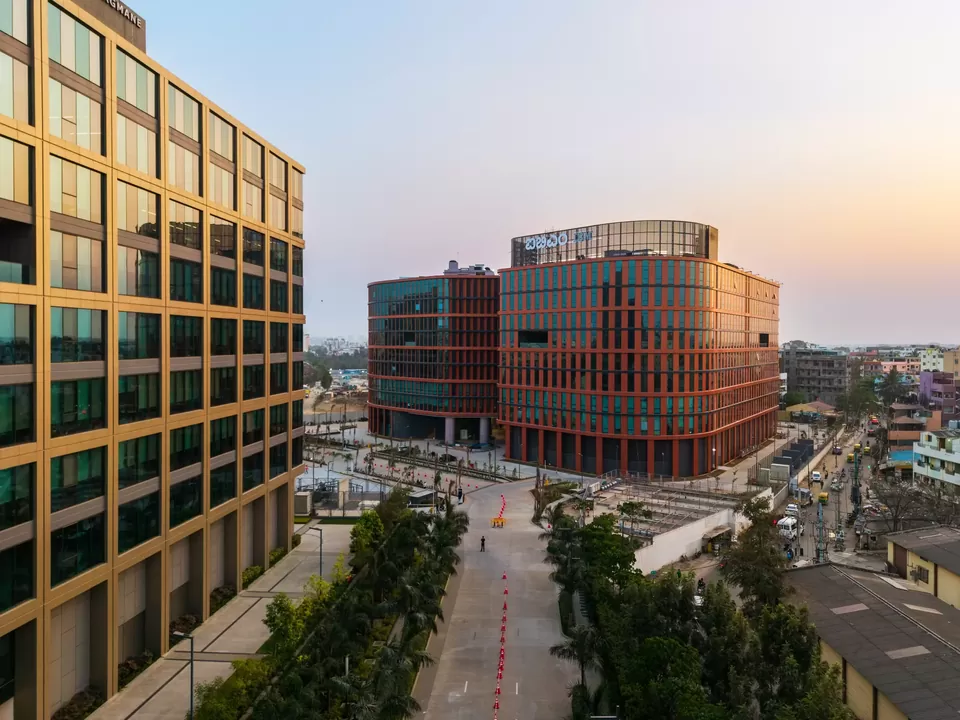 Oblique drone view of Bagmane Group commercial buildings at dusk